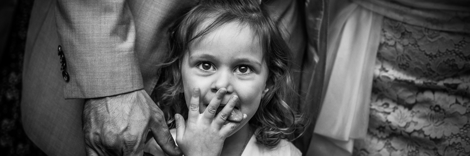 Family Portrait Photography: A young girl sticking her tongue out