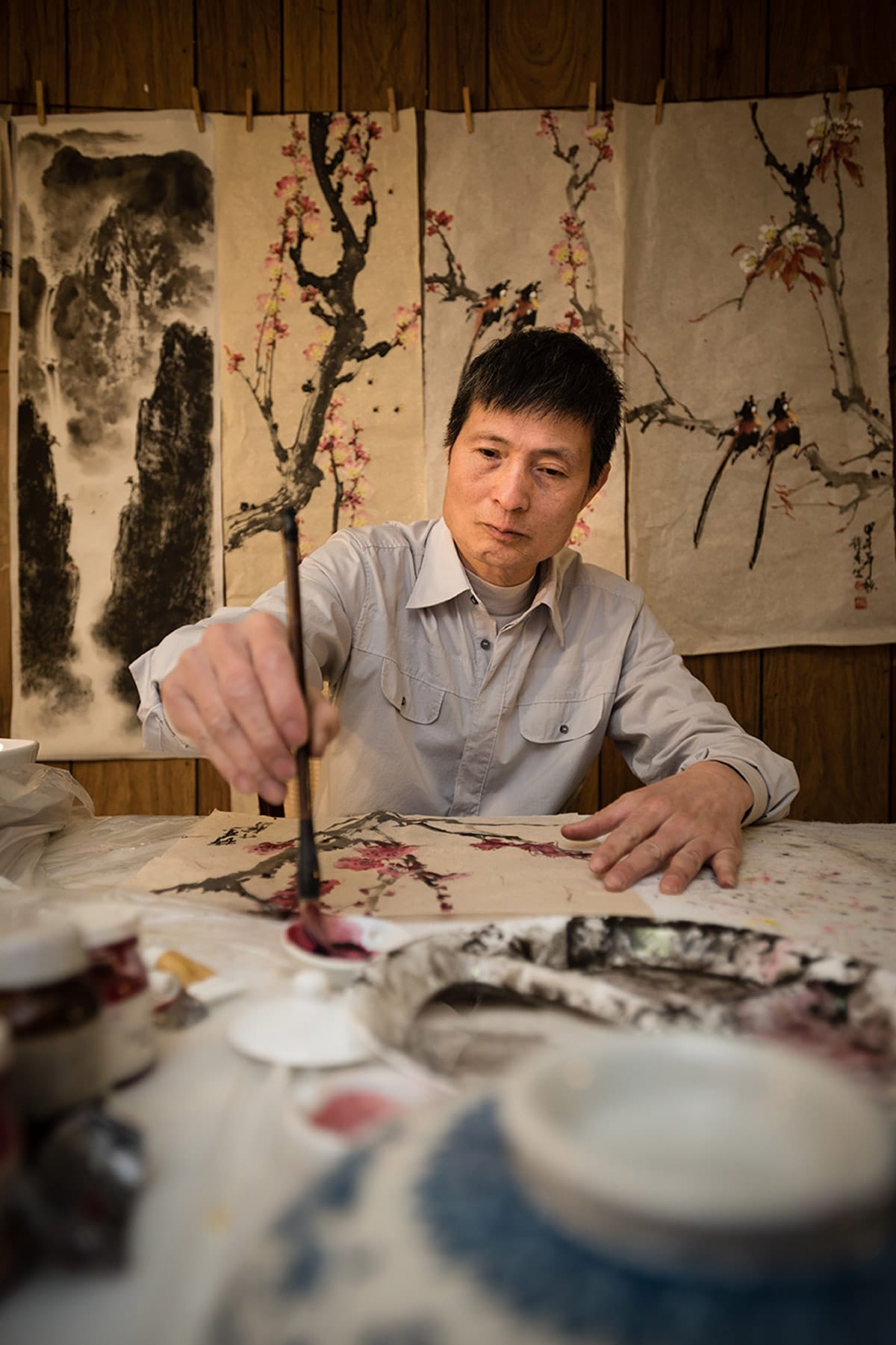 personal branding photo of a Chinese man painting
