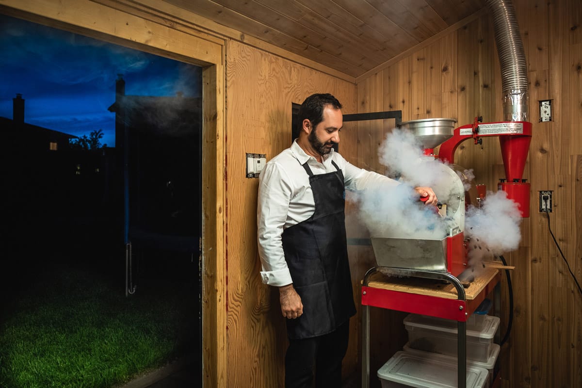 Personal branding photo of a man using a machine producing lots of steam
