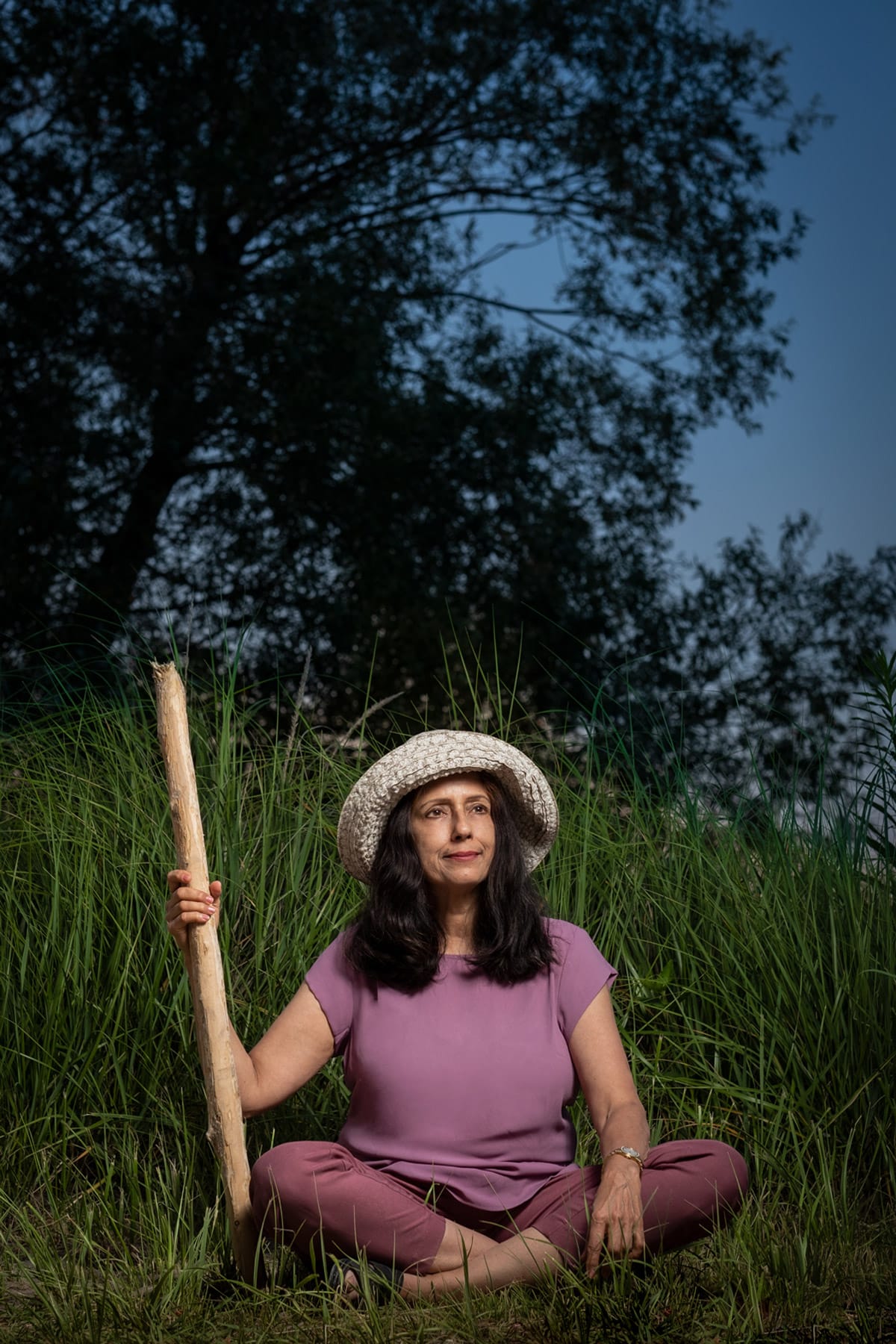 personal branding photo of a yoga instructor sitting in the long grass