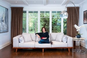 personal branding photo of a woman sitting on a couch