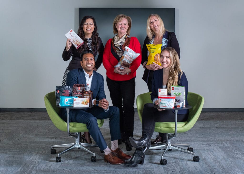Corporate and professional portrait of a team with grocery products