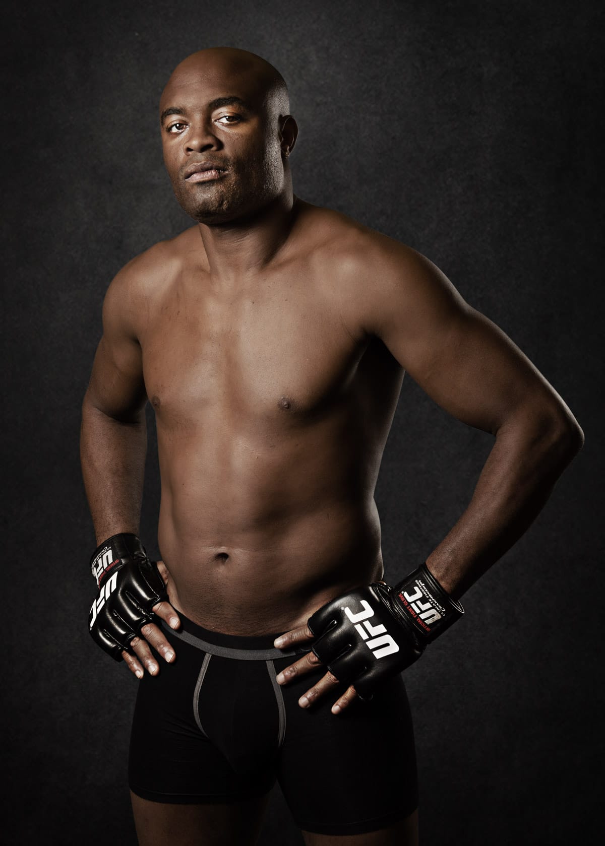 Professional portrait of a UFC Fighter posing with his hands on his hips